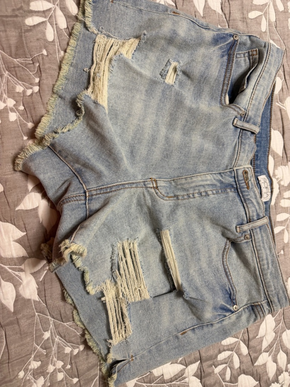 Distressed Light Wash Denim Cutoff Shorts